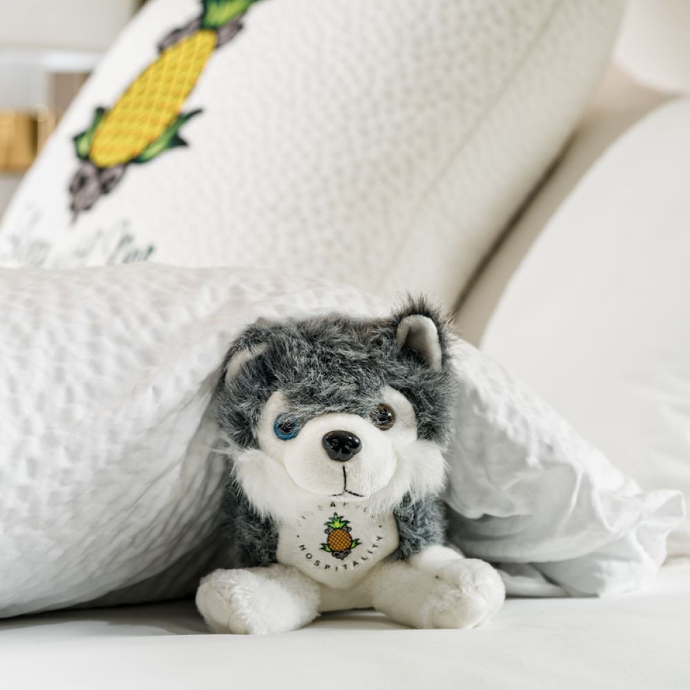 A Stuffed Animal On A Bed